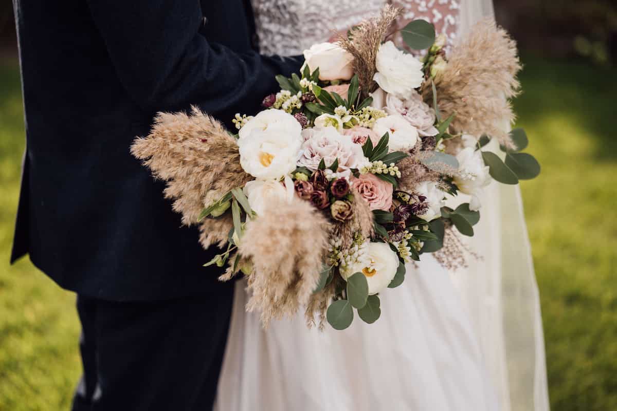 A large mostly white bridal bouquet